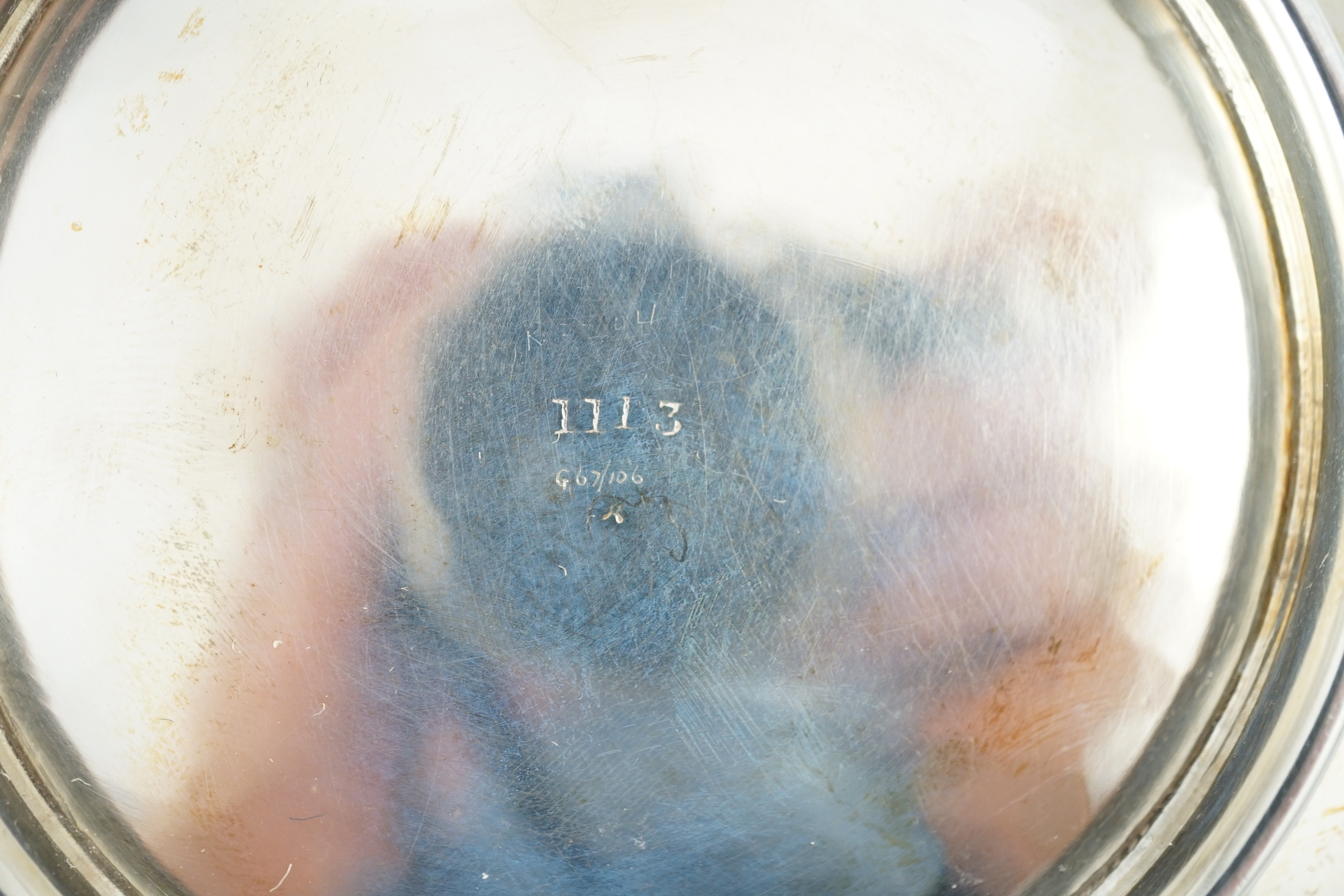 A George V Arts & Crafts planished silver two handled shallow dish, by Albert Edward Jones